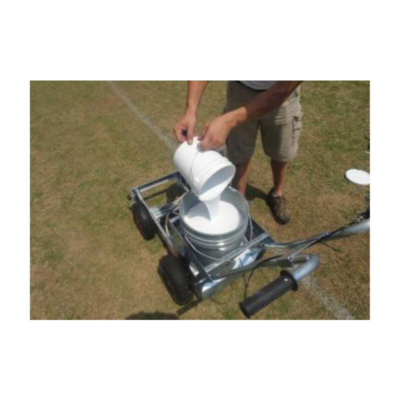 Striping soccer field with field marking paint.