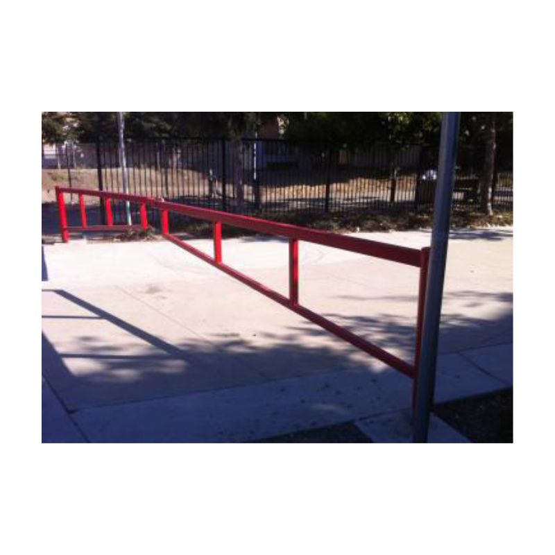 Coated Metal Pipes Positioned Above A Red Industrial Pipe Support System