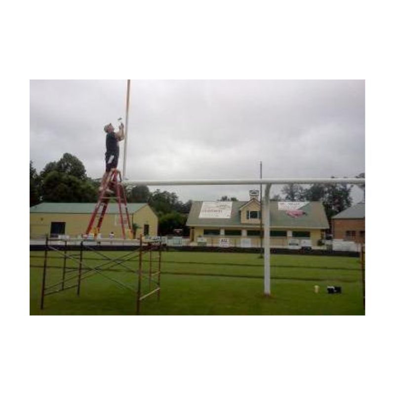 Distant View Of Field Goal Post Painted Yellow Using Direct-To-Metal Coating