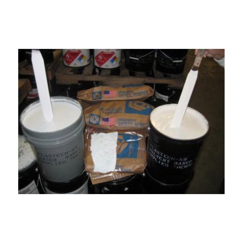 Various Paint Containers And Tools Arranged At A Worksite