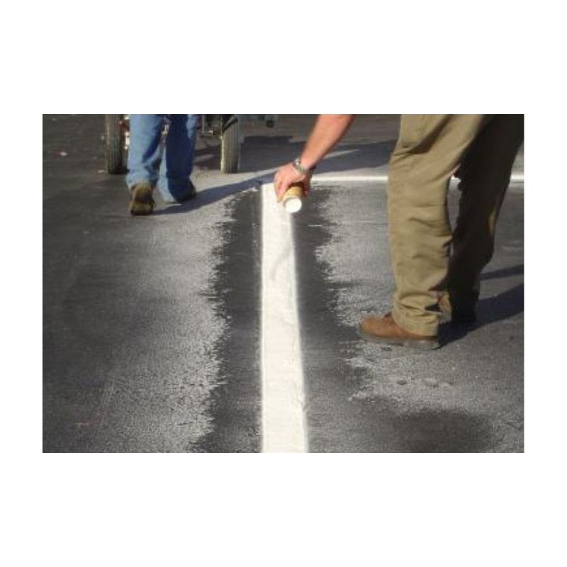 Person Applying White Line Marking Paint To Pavement Surface