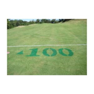 Green golf course fairway yardage marking paints.