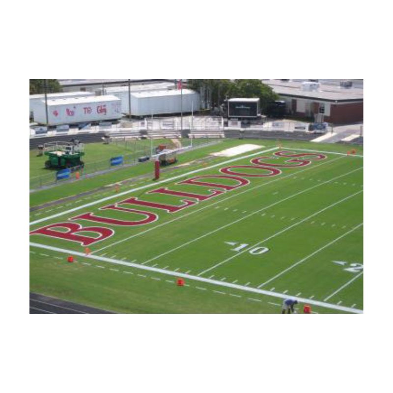 Red color football field end zone marking line striping paint.