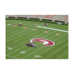 Field painting mid field college logo red bright white paint.