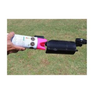 Person Using Aerosol Can With Long Wand For Utility Marking On Grass
