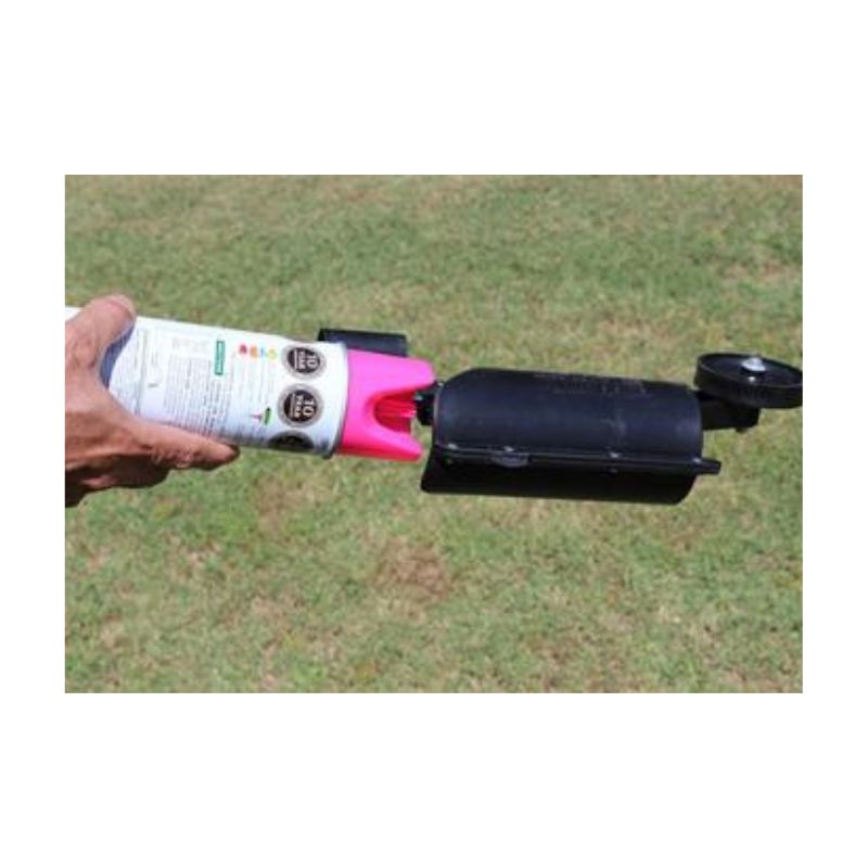 Person Using Aerosol Can With Long Wand For Utility Marking On Grass