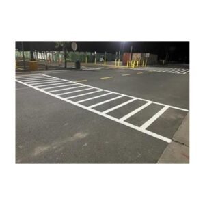 White Striped Diagonal Parking Lot Section With Curb Stops