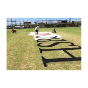 Outdoor Logo Stencil Setup On Grass With Painting Tools