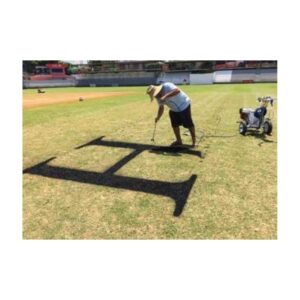 Person Painting A Black Square Stencil Logo On A Sports Field