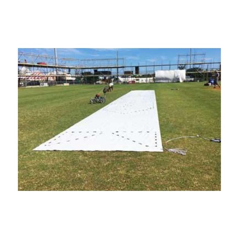 Long White Fabric Or Cover Laid Out On A Grassy Field
