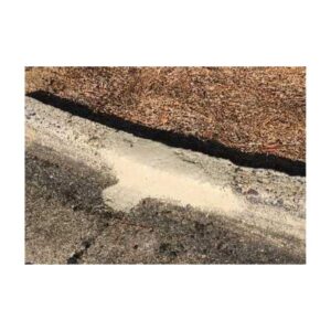 Concrete Curb Section Freshly Patched With Repair Kit