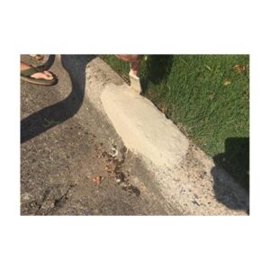 Concrete Curb Undergoing Patch Repair Process