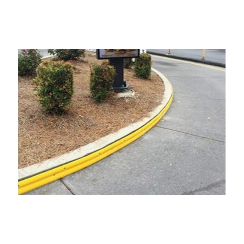 Yellow-Painted Curb Edge In A Landscaped Parking Area