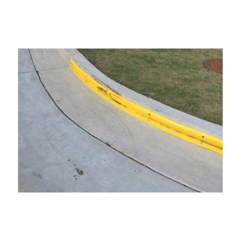 Yellow Curb Marking On Concrete