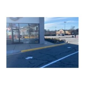 Freshly Painted Blue And White Curbside Parking Space Outside A Storefront