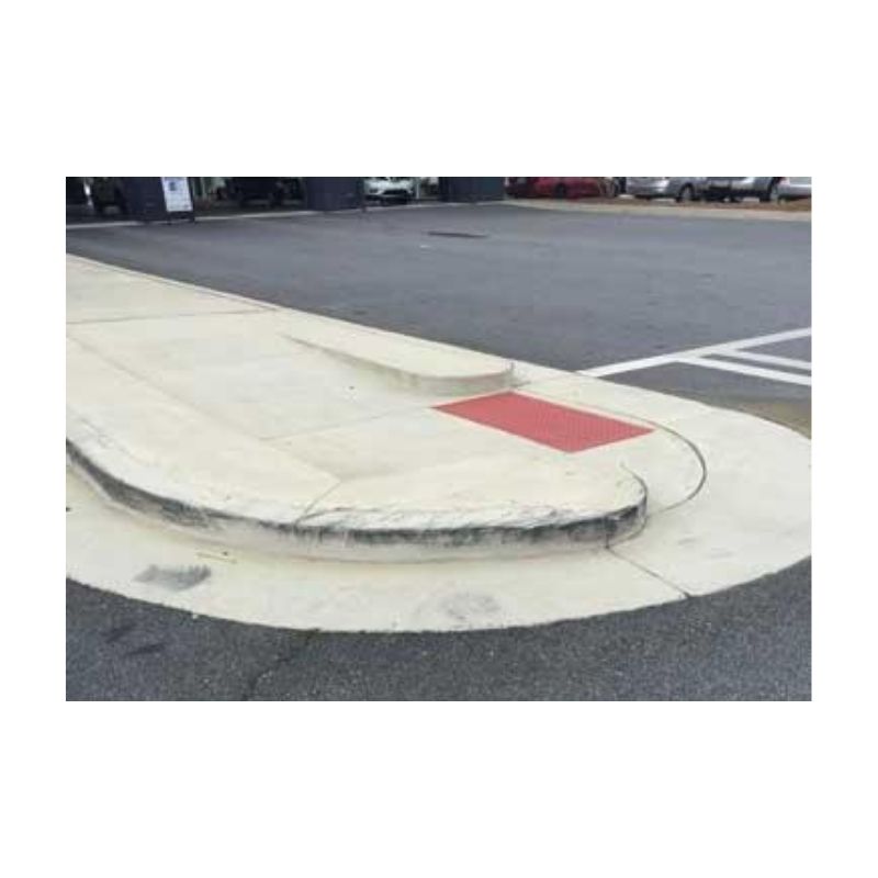 Close-Up Of Concrete Curb With Red-Painted Section
