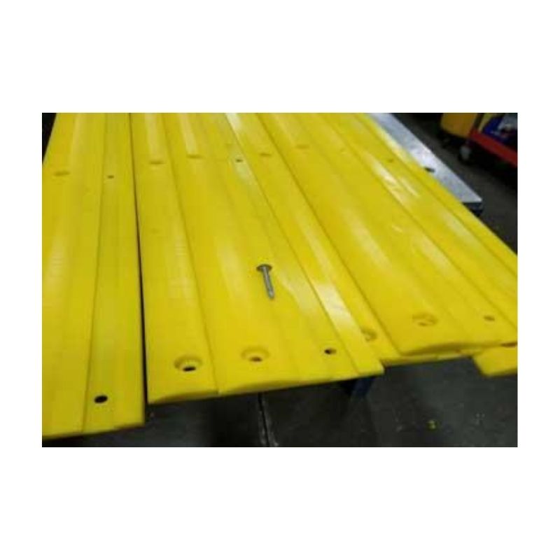 Bright Yellow Curb Hugging Material Installed On Pavement