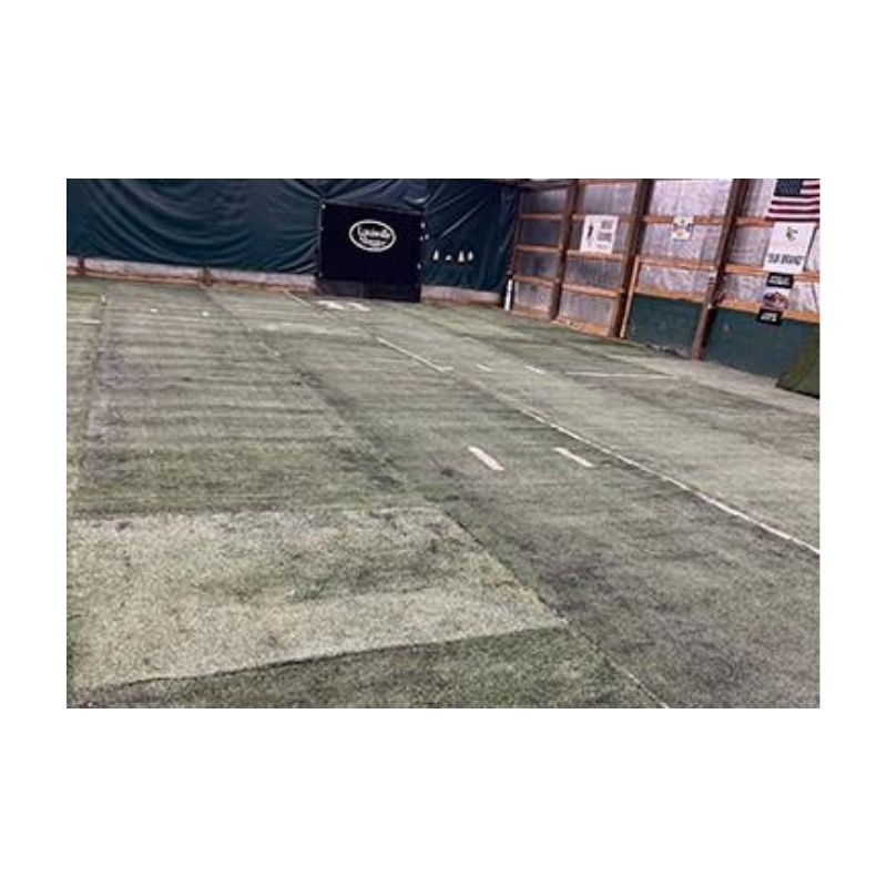 Old synthetic used turf with permanent sewed in line getting painted with permanent green paint.