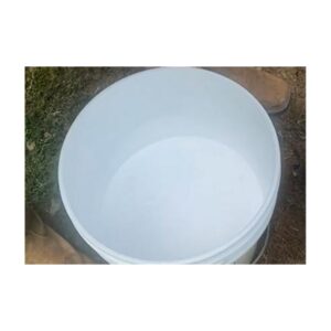 White Liquid Inside A Bucket On Grass