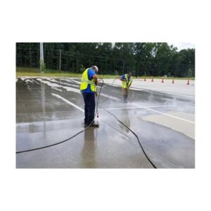 Surface Preparation Pressure Washing Of Old Traffic Line Paint.