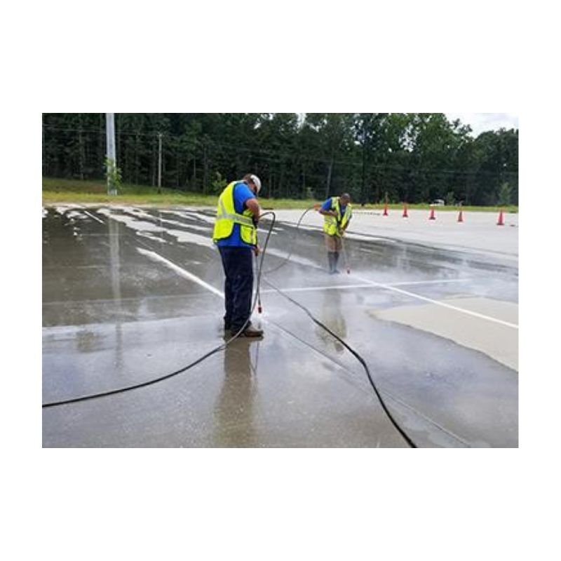 Surface Preparation Pressure Washing Of Old Traffic Line Paint.