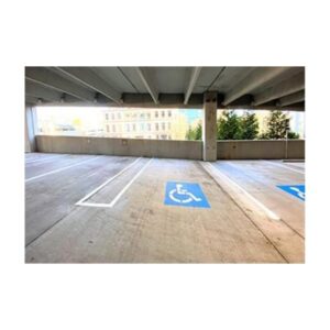 Parking Garage With Blue Handicapped Parking Spaces