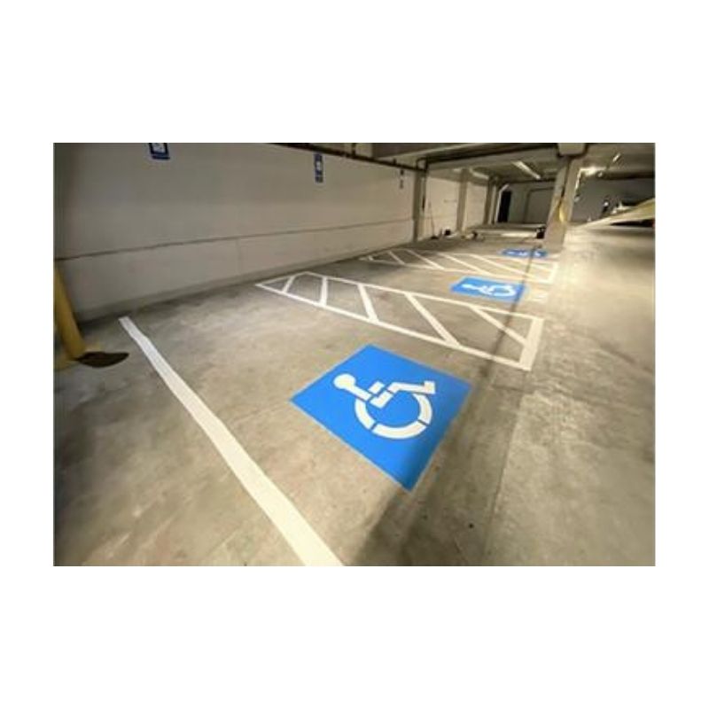 Blue Handicap Parking Symbol Painted On Warehouse Floor
